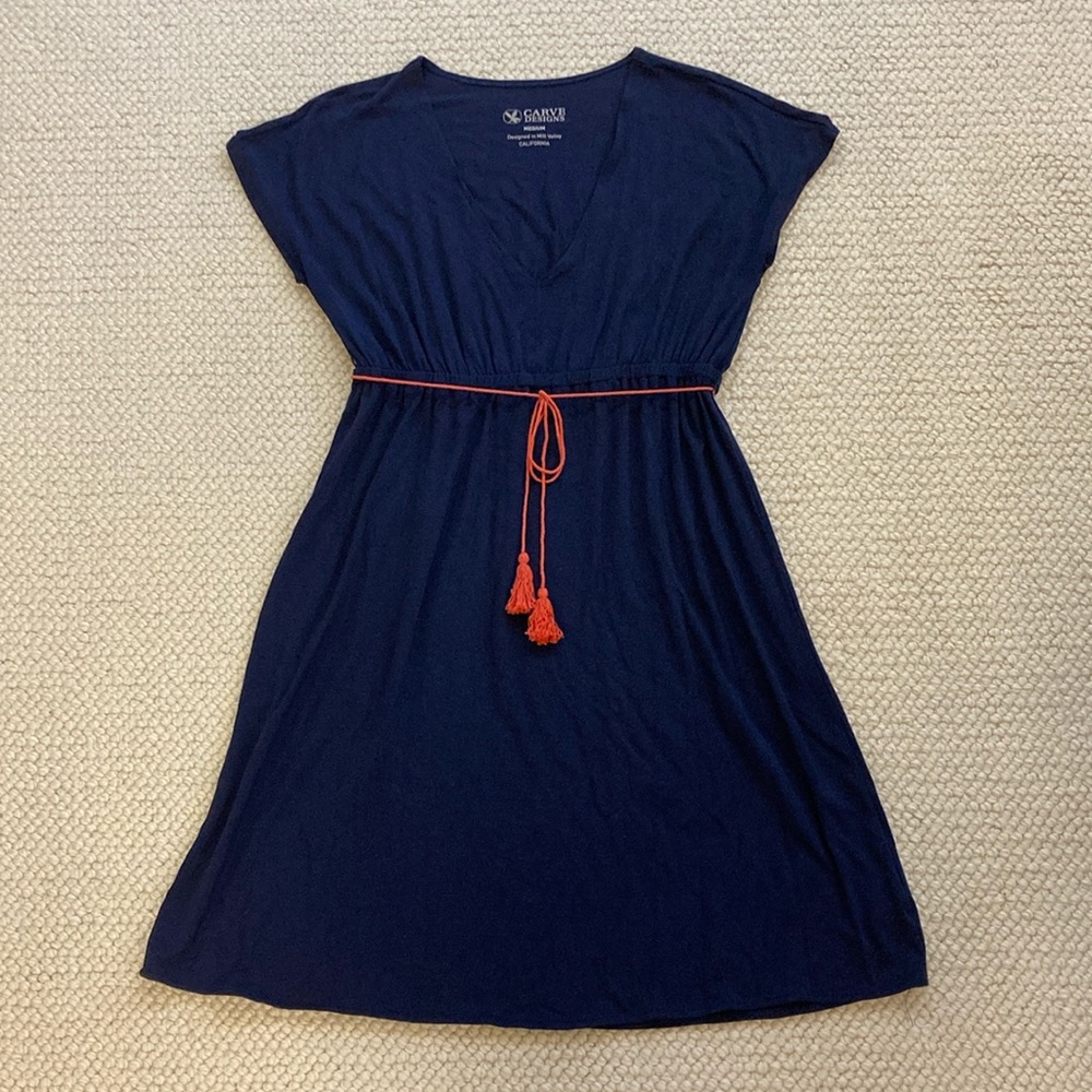 Carve summer dress with coral tie at waist.